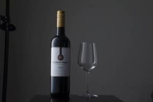 Wine bottle on grey background
