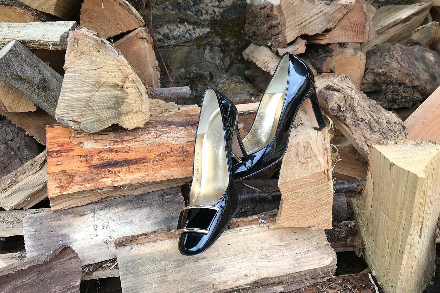 living-in-france Heels on a pile of logs in the Dordogne