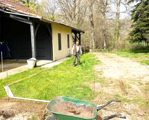 Preparing the petanque court Our local expert helping to prepare the petanque court