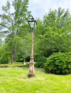 Garden Narnia lamppost before restoration