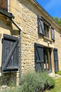 Gite exterior with wooden shutters