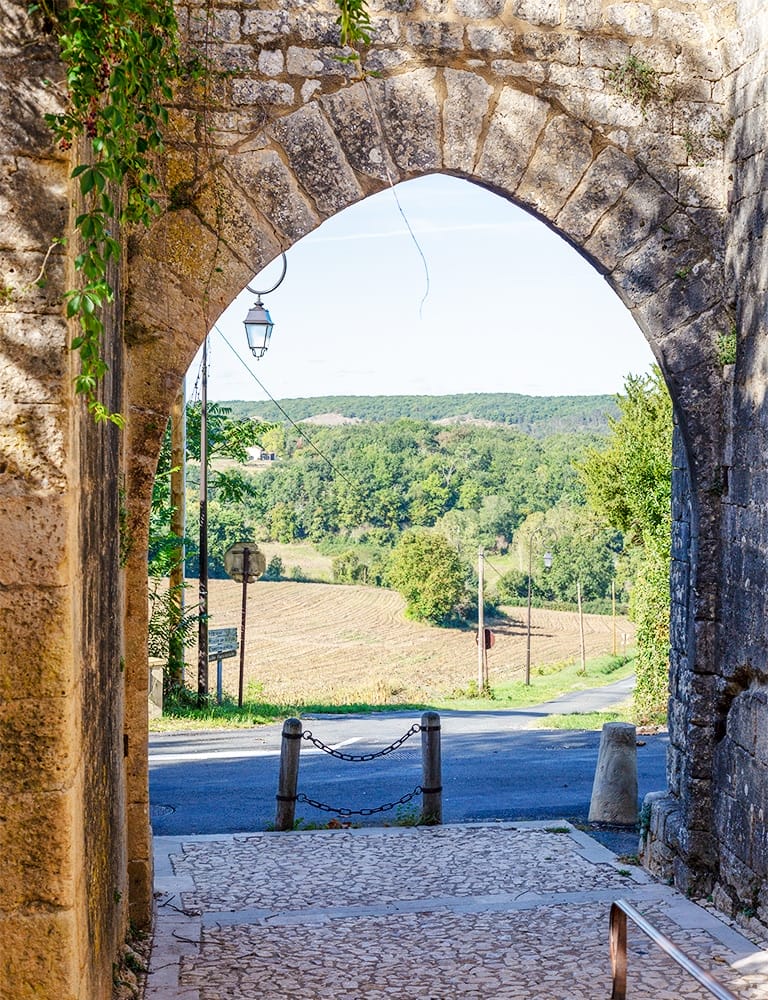 Exploring Perigord View from an arched doorway in Perigord in the Dordogne