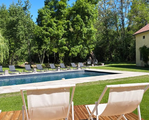 By the pool Deck chairs and sun loungers by the pool