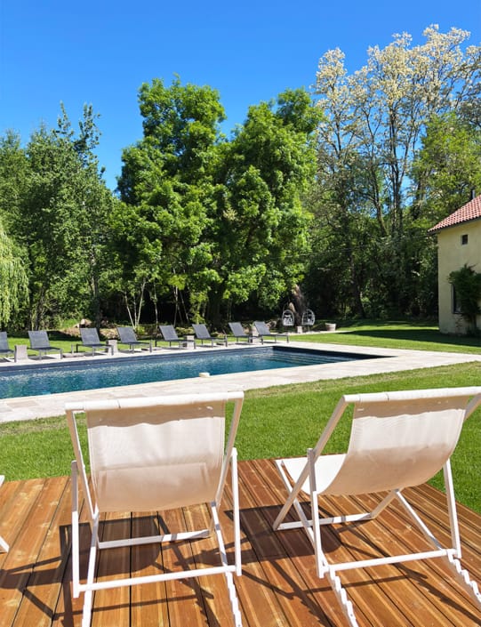 By the pool Deck chairs and sun loungers by the pool