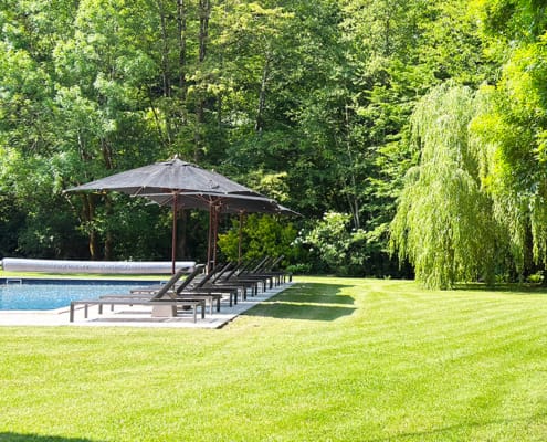 Gite pool Gite swimming pool and lush green lawn