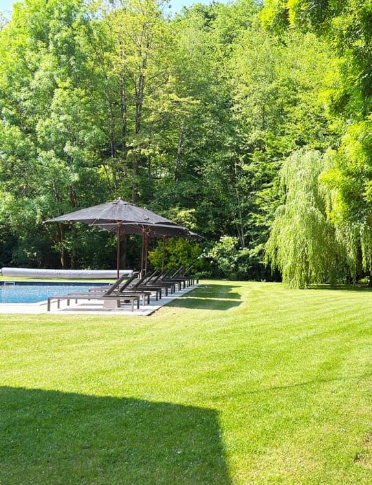 Gite pool Gite swimming pool and lush green lawn